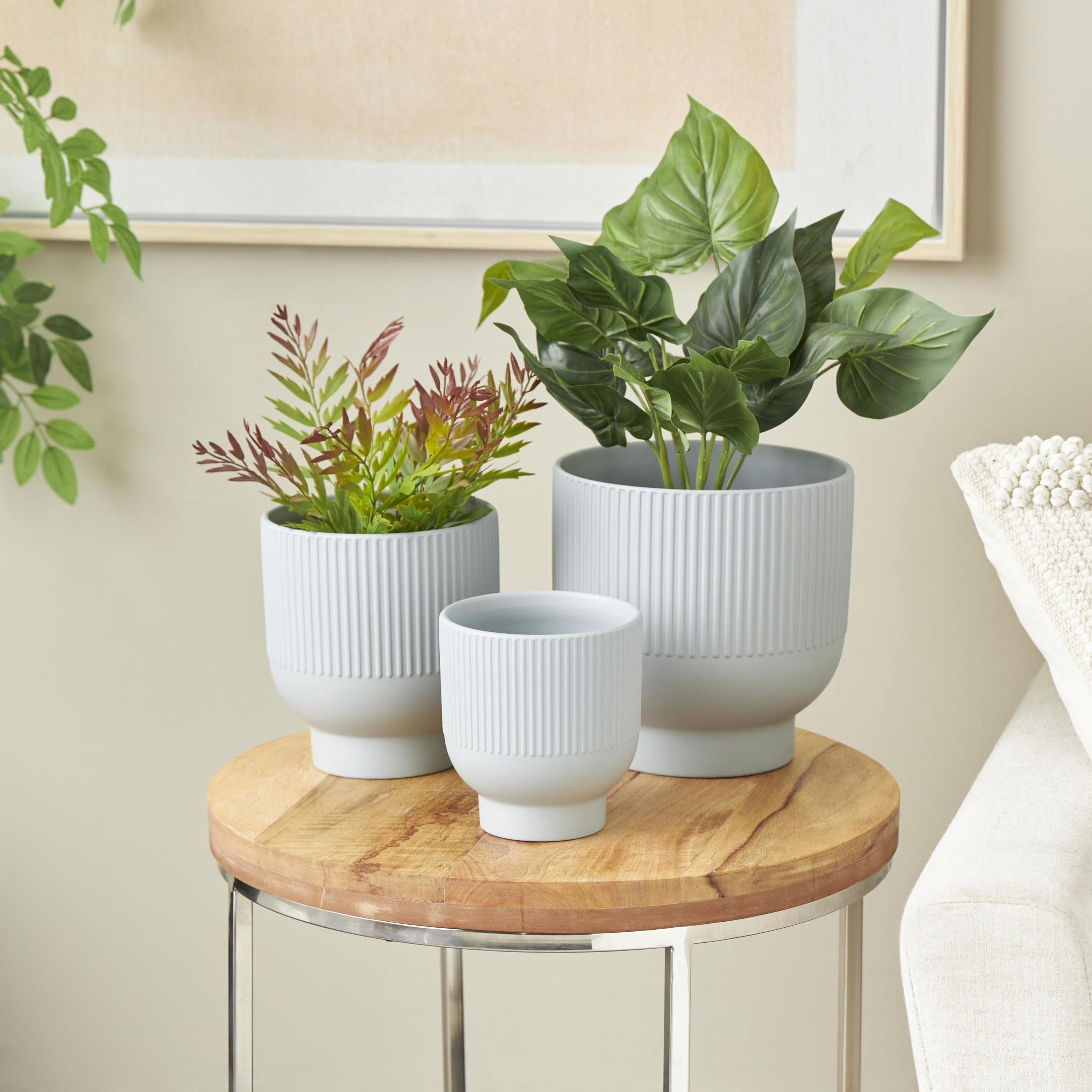 DecMode 9", 7", 5"W Light Blue Ceramic Planter with Linear Grooves and Tapered Bases (3 Count)