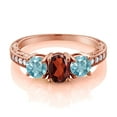 thumbnail image 2 of Gem Stone King 2.69 Ct Oval Red Garnet Blue Zircon 18K Rose Gold Plated Silver Moissanite Ring (Size 8), 2 of 4