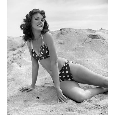 1950s 1960s Brunette Bathing Beauty Stretched Out On Sand