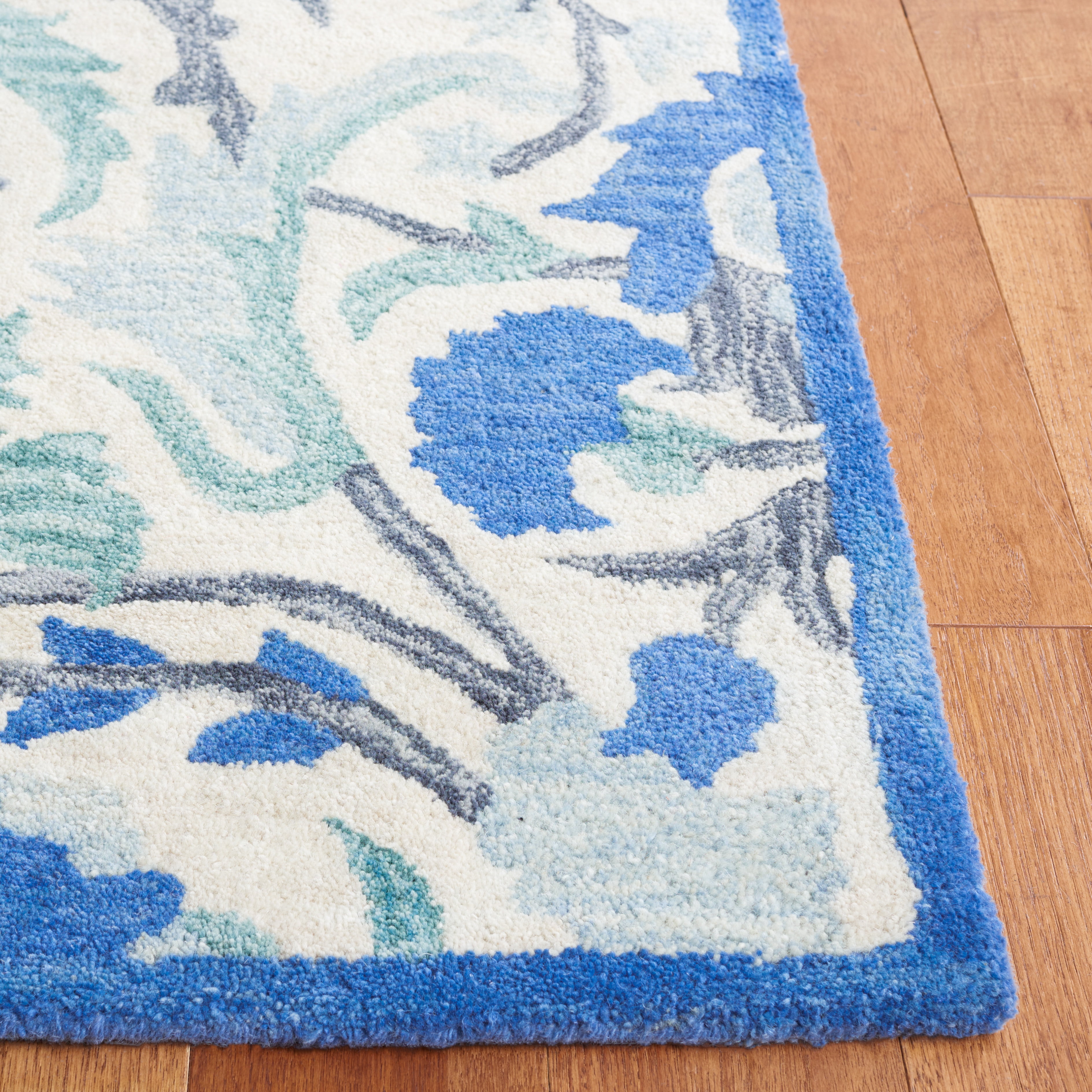 SAFAVIEH Antiquity Raschelle Oriental Wool Area Rug, Ivory/Blue, 9' x 12'
