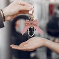 thumbnail image 5 of Pearl Bow Keychain Cute Bow Keychain Wristlet for Women, Purse Charms Pearl Keychain Pearl Key Ring Bowknot Key Chain Bracelet, 5 of 7