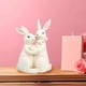 thumbnail image 5 of Estatua de resina de conejo de Pascua | Figura con aspecto de porcelana blanca • Adorno decorativo de mesa de 20 cm • Pintado a mano • Regalo festivo para sala de estar, estantería, oficina y repisa, 5 of 9