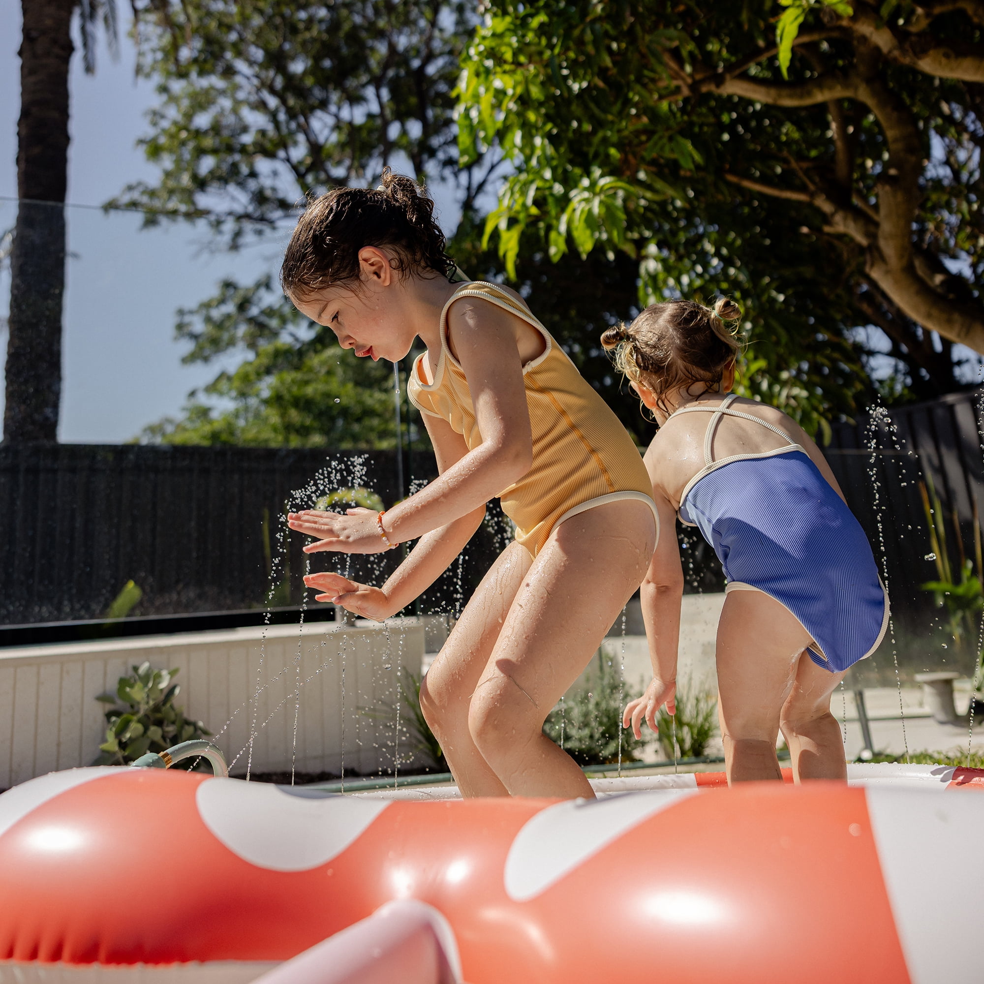 Sunnylife: Kids Sprinkler Mat - Poppy the Peach - Red-White Striped Fruit Character, 59" Inflatable Water Sprayer Wade Pool, Outdoor Play Splash Center