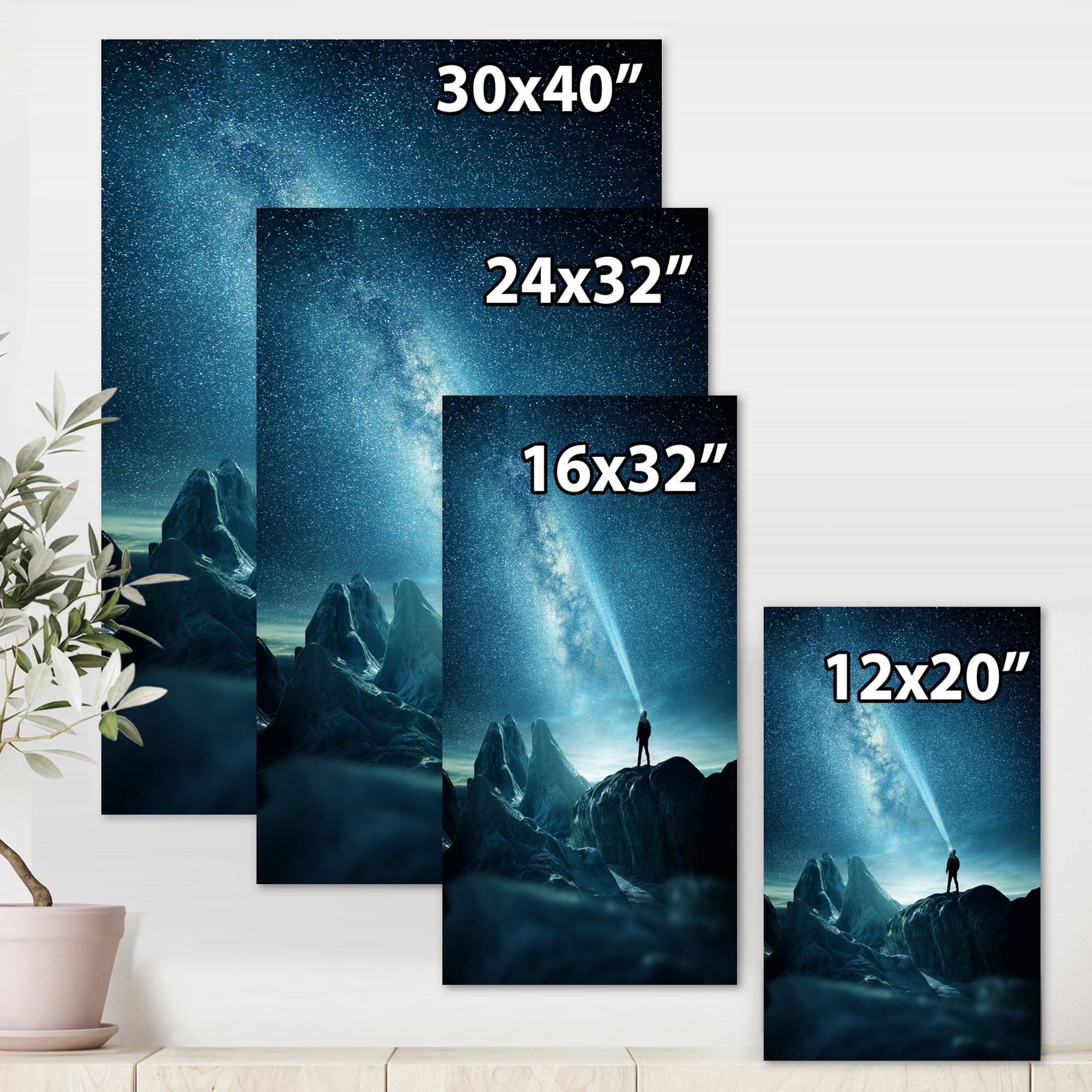 A Light Shining by A Man Shining Into The Night Sky 12 in x 8 in Photography Canvas Art Print, by Designart