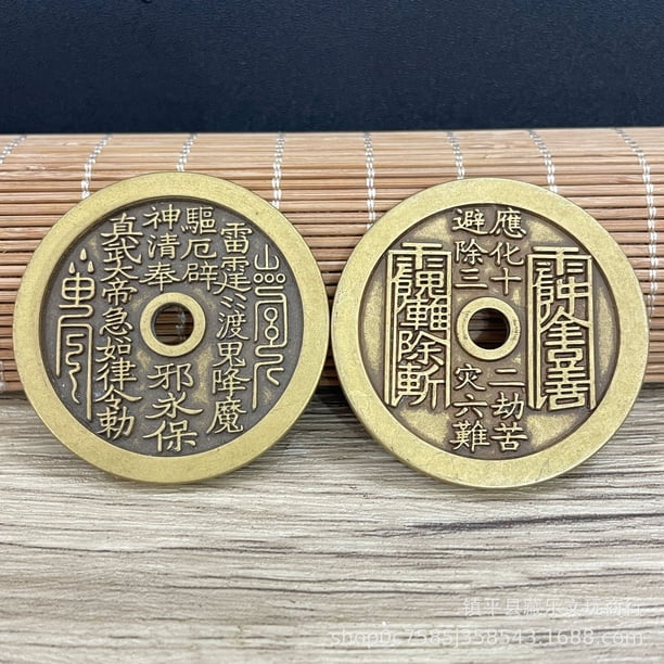 Exquisitely crafted antique-style copper coins, including those depicting mountain spirits, Laozi (the Supreme Lord Lao), and high-relief auspicious symbols of good fortune and longevity.