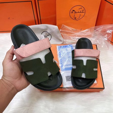 

Women wearing platform slippers over slippers