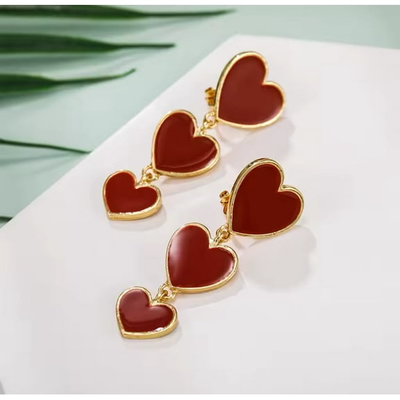Trendy 2" clip on gold and red dangle three heart earrings