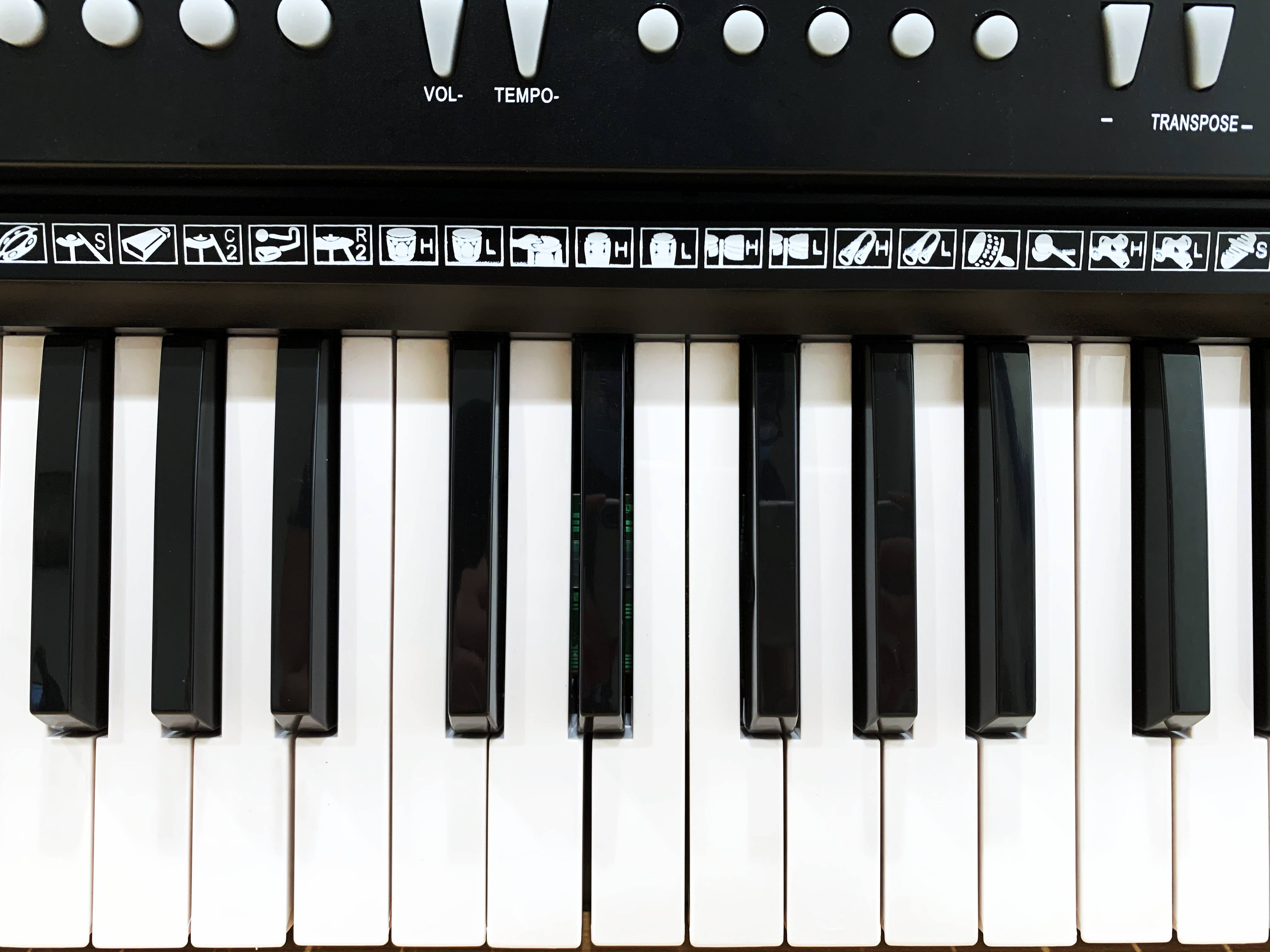 Learn piano online by yourself. Use a tablet or computer to learn piano  tutorials online. The black grand piano has a tablet placed on a notebook  stand. 3D Rendering. 6667060 Stock Photo