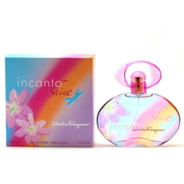 Incanto Shine by Salvatore Ferragamo For Women Eau de Toilette Spray 3.4 OZ with a rounded translucent bottle featuring pink floral and blue leaf designs, a pink cap, and a colorful gradient box. This floral fruity perfume blends pineapple, bergamot, passion fruit, pink peony, freesia, peach, cedar, amber, and musk, suitable for daily wear.