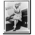 thumbnail image 2 of Historic Framed Print, [Claire May Fahy, full-length portrait, facing front, seated on outside tail of airplane], 17-7/8" x 21-7/8", 2 of 9