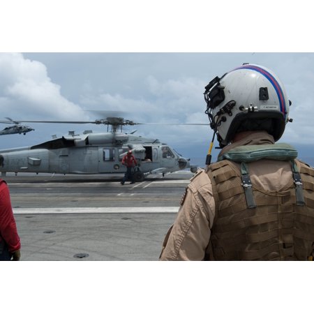 - LAMINATED POSTER Crewmembers, from the Golden Falcons of Helicopter Sea Combat Squadron (HSC) 12, wait to board the Poster Print 24 x 36