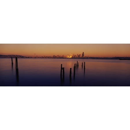 Washington Set - Wooden posts in the sea at dusk Seattle Washington State USA Poster Print
