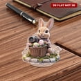 thumbnail image 4 of Rotating acrylic display showcasing a realistic bunny in a flowery Easter basket holding a camera on a cobblestone platform with intricate details, 4 of 8