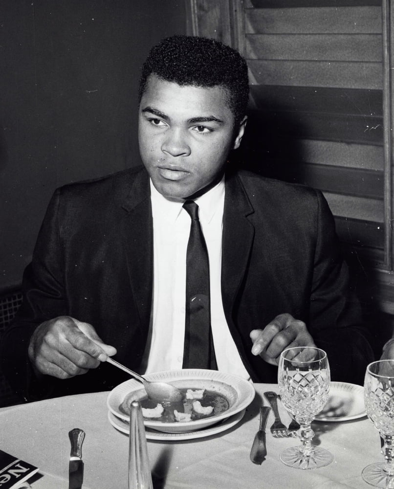 Muhammad Ali eating a meal Photo Print - Walmart.com