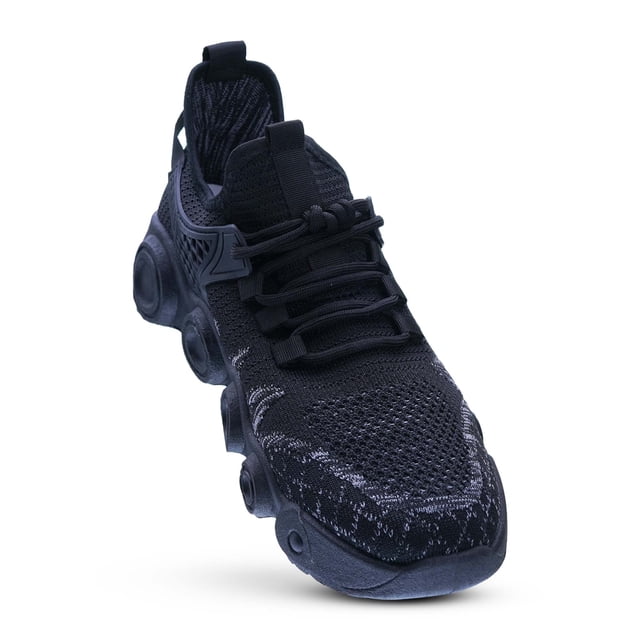 tenis hombre para entrenamiento caminar correr gimnasio zapato deportivo ultra comodos con suela antiderrapante uso sport casual fitness gaon gaon 14 negro. Vista frontal 3/4 de un tenis GAON con empeine de malla tejida transpirable, cierre clásico de cordones y tirador en el talón. Suela visible con tacos circulares antideslizantes y plataforma ligera; fondo blanco, indicado para entrenamiento, caminata y uso casual.