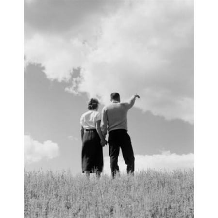 Posterazzi SAL255422153 Young Couple Standing & Holding Hands Rear View Poster Print - 18 x 24 in.