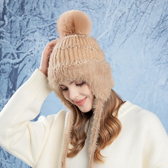 RXIRUCGD Women's Winter Outdoor Cold Protection Warm Large Head Circumference Plus Velvet Ear Protection Fashionable Knitted Wool Hat in khaki. The hat features a soft knitted wool design with a pom-pom on top, ear flaps for added warmth, and a cozy velvet lining. Suitable for winter wear, it offers a comfortable fit with a circumference of 55-60 cm and a height of 22 cm. The khaki colour complements various outfits, making it both functional and stylish.