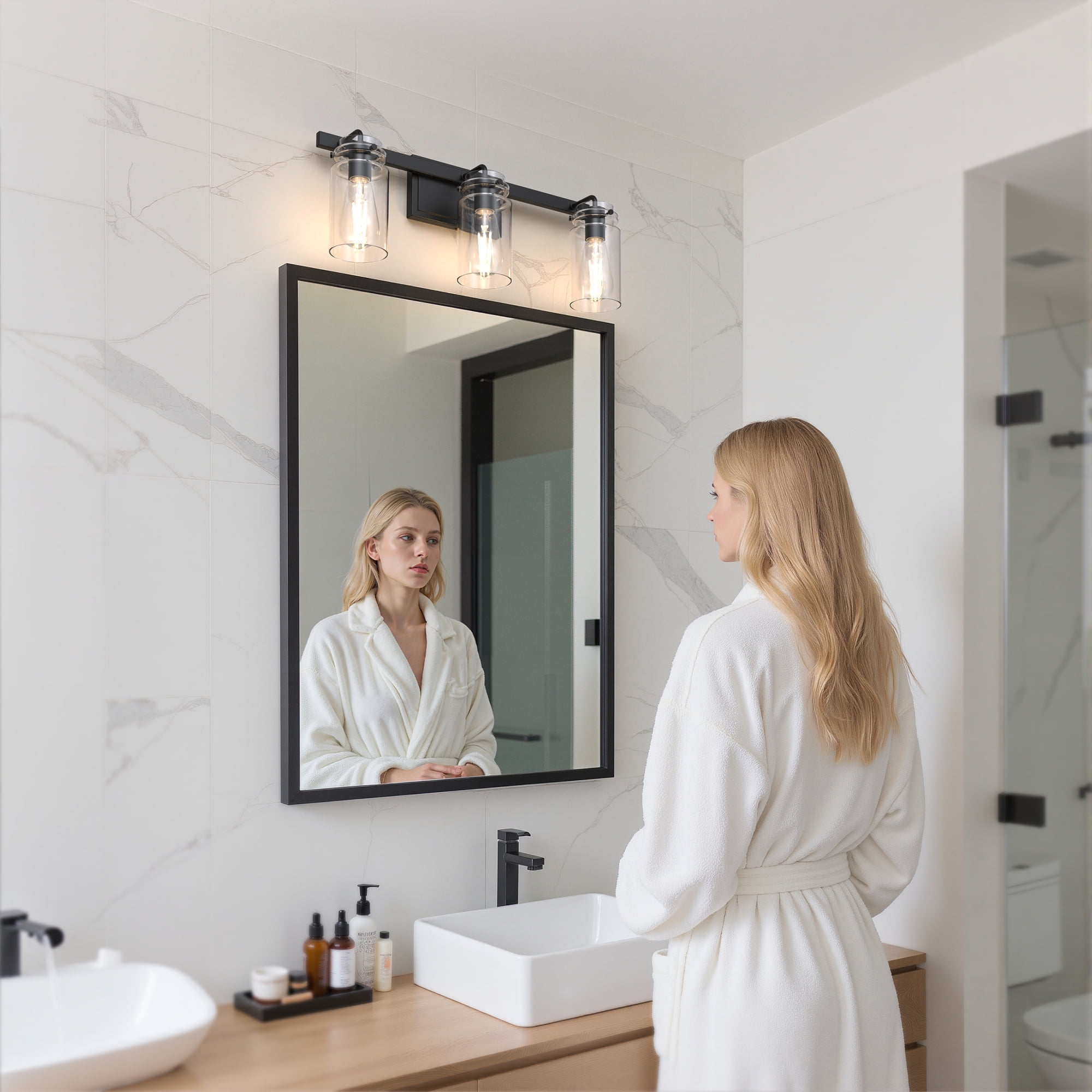 YANSUN 24 in 3-Light Black Modern Cylinder Vanity Light, Clear Glass Bathroom Wall Fixture Over Mirror, for Bathrooms, Powder Rooms, or Vanity Nooks