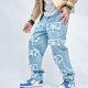 thumbnail image 3 of Pantalones vaqueros rectos de empalme con parche rasgado para hombre, ropa de calle de Hip Hop, pantalones de mezclilla sueltos para motociclista, 3 of 4