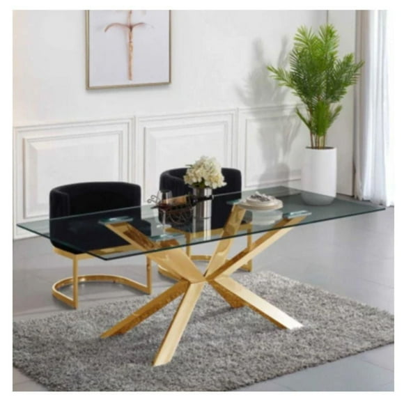 Table de salle à manger Culture avec plateau en verre et base en métal doré.