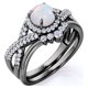 thumbnail image 3 of JeenMata Anillo de Bodas de 1,15 Quilates con Ópalo de Fuego Azul Redondo Vintage y Moissanita Engastado en Oro Negro de 18 K sobre Plata, 3 of 5