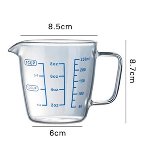 MEASURING CUP, 250ml transparent glass measuring cup with handle, featuring blue conversion measurement scales for ounces and milliliters. Made of heat-resistant borosilicate glass, suitable for microwave, refrigerator, freezer, and dishwasher use. Ideal kitchen tool for measuring wet and dry ingredients. Dimensions: 8.5cm x 8.7cm x 6cm.
