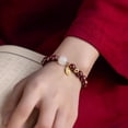 thumbnail image 2 of Pulsera de cinabrio hecha a mano con amuleto dorado de la fortuna, 2 of 2