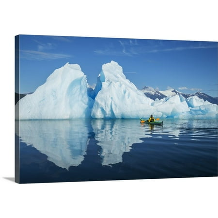 Premium Canoe Paddle Wall Decor - Great BIG Canvas John Hyde Premium Thick-Wrap Canvas entitled A Sea Kayaker Paddles Beside An Iceberg In Southeast Alaska's Stephens