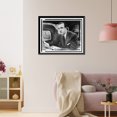 thumbnail image 3 of Historic Framed Print, [Walter Cronkite, half-length portrait, facing left, seated at desk with notes in hand and television monitor showing his image for The Morning Show"", 17-7/8" x 21-7/8", 3 of 9