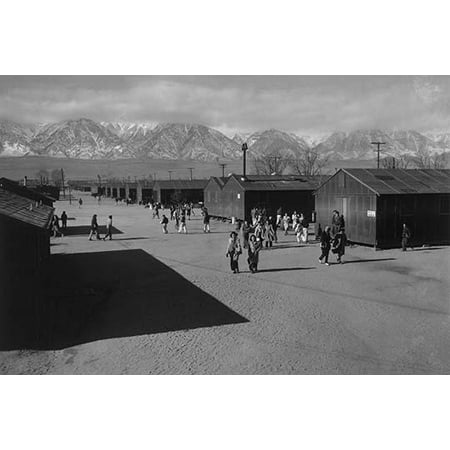 Students walking in road between buildings  Ansel Easton Adams was an American photographer best known for his black-and-white photographs of the American West  During part of his career he was