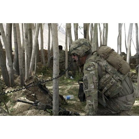 US Army soldier communicates possible enemy locations during combat in Afghanistan Canvas Art - Stocktrek Images (35 x 23)
