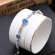 thumbnail image 4 of Brazalete de cristal azul Sonducket con cadena de mano de circón y dijes de amor, 4 of 6