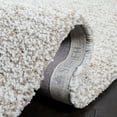 thumbnail image 5 of SAFAVIEH Ultimate Atanas Solid Plush Polyester Shag Area Rug, Sand/Ivory, 8' x 10', 5 of 6