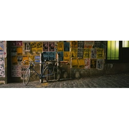 Bicycle leaning against a wall with posters in an alley Post Alley Seattle Washington State USA Canvas Art - Panoramic Images (36 x