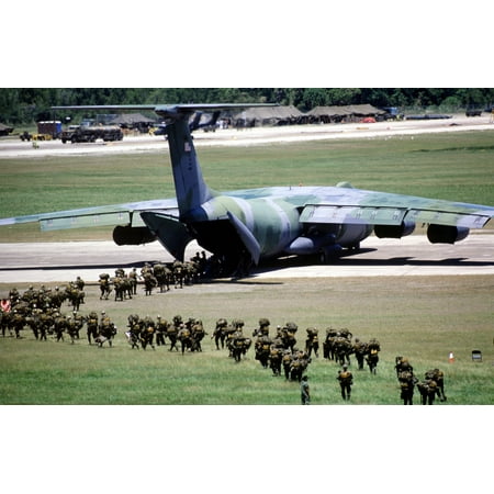 Airborne Flight - Members of the 82nd Airborne Division board a C-141B Starlifter aircraft for a flight back to Fort B Poster Print 24 x 36