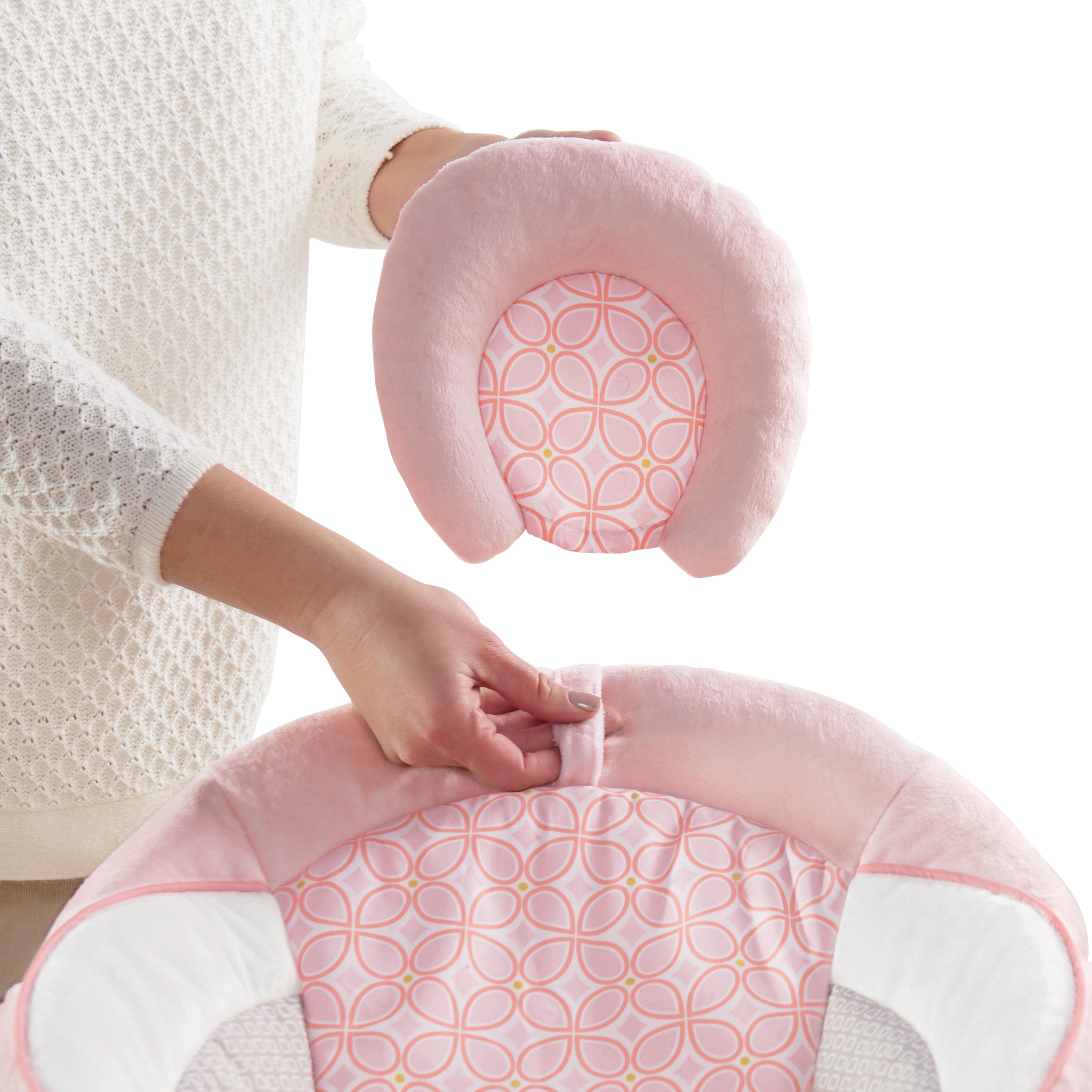 audrey cradling bouncer in pink