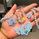 thumbnail image 1 of Nuevo collar luminoso con láser de Sanrio para niños, bonito brazalete colorido con dibujos animados, regalo para niñas, joyería, 1 of 4