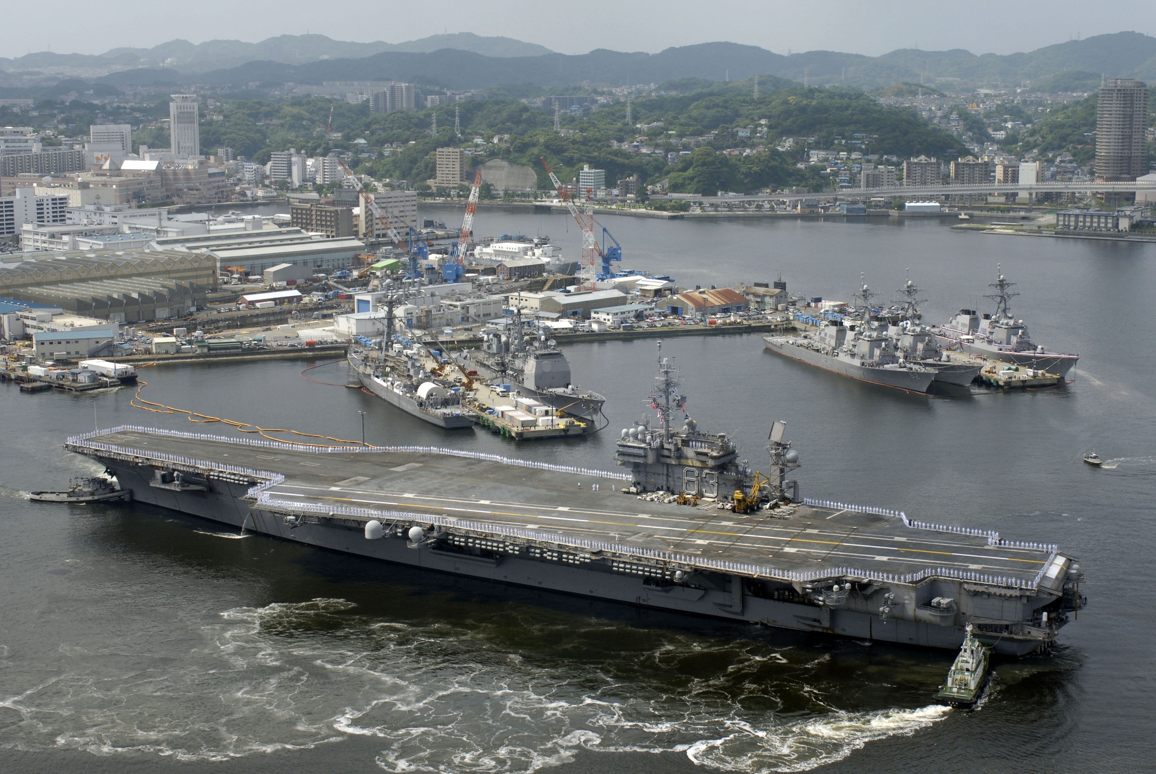 LAMINATED POSTER The aircraft carrier USS Kitty Hawk (CV 63) departs
