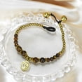 thumbnail image 3 of AeraVida Mystical Aum or Om Brown Tiger's Eye and Brass Beads Jingle Bell Bracelet for Female Anniversary, 3 of 6