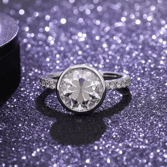 Oryn Jewelry 2 Ct Round Brilliant Cut Moissanite Ring - 14K White Gold Plated Solitaire Ring for Her - Women's Bezel Set Engagement Jewelry - Accent Ring Design