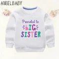 thumbnail image 3 of Anuncio de sudaderas para niños con estampado de "Me ascienden a hermana mayor" en 2024, ropa para niñas embarazadas y mamás, sudaderas con capucha para bebés y niños, 3 of 5