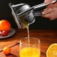 thumbnail image 1 of Exprimidor de limón de acero inoxidable, exprimidor manual de cítricos, lima, naranja, exprimidor de frutas, mango ergonómico resistente, ahorro de mano de obra, prensa de jugo de gran capac, 1 of 5