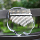 thumbnail image 2 of Piano de pulgar portátil de 17 tonos de cristal transparente con forma de conejo y oso, fácil de transportar, 2 of 4