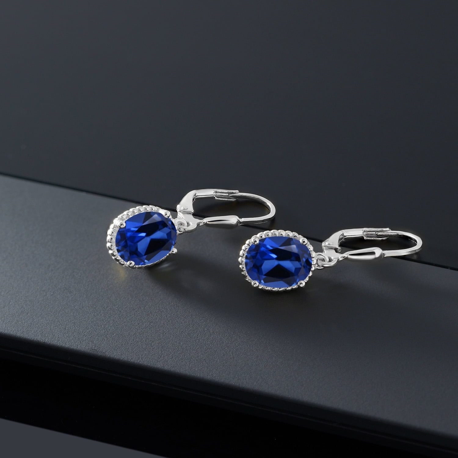 Gem Stone King 925 Sterling Silver Blue Created Sapphire Leverback Dangle Earrings for Women (4.60 Cttw, Gemstone September Birthstone, Oval 9X7MM)