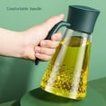 thumbnail image 6 of ​XUFLVPSEF Automatic Glass Oil Dispenser Bottle, 34oz Leak-Proof Kitchen Container for Olive Oil, Vinegar, Liquid Seasonings, One-Hand Pour Spout, 6 of 9
