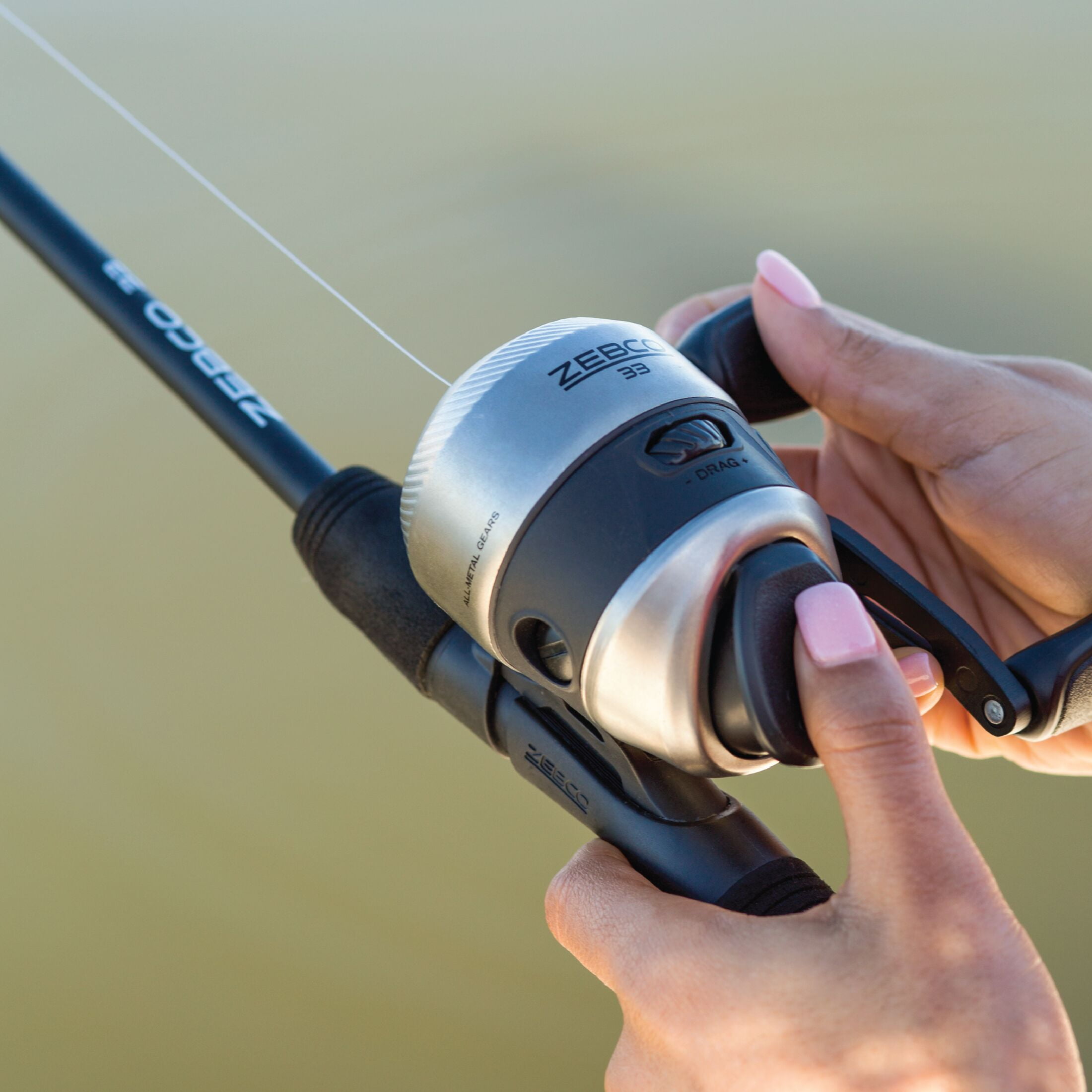 Zebco 33 Spincast Reel and Fishing Rod Combo, 6-Foot 2-Piece Fiberglass Rod with EVA Handle, Quickset Anti-Reverse Fishing Reel with Bite Alert, Silver/Black