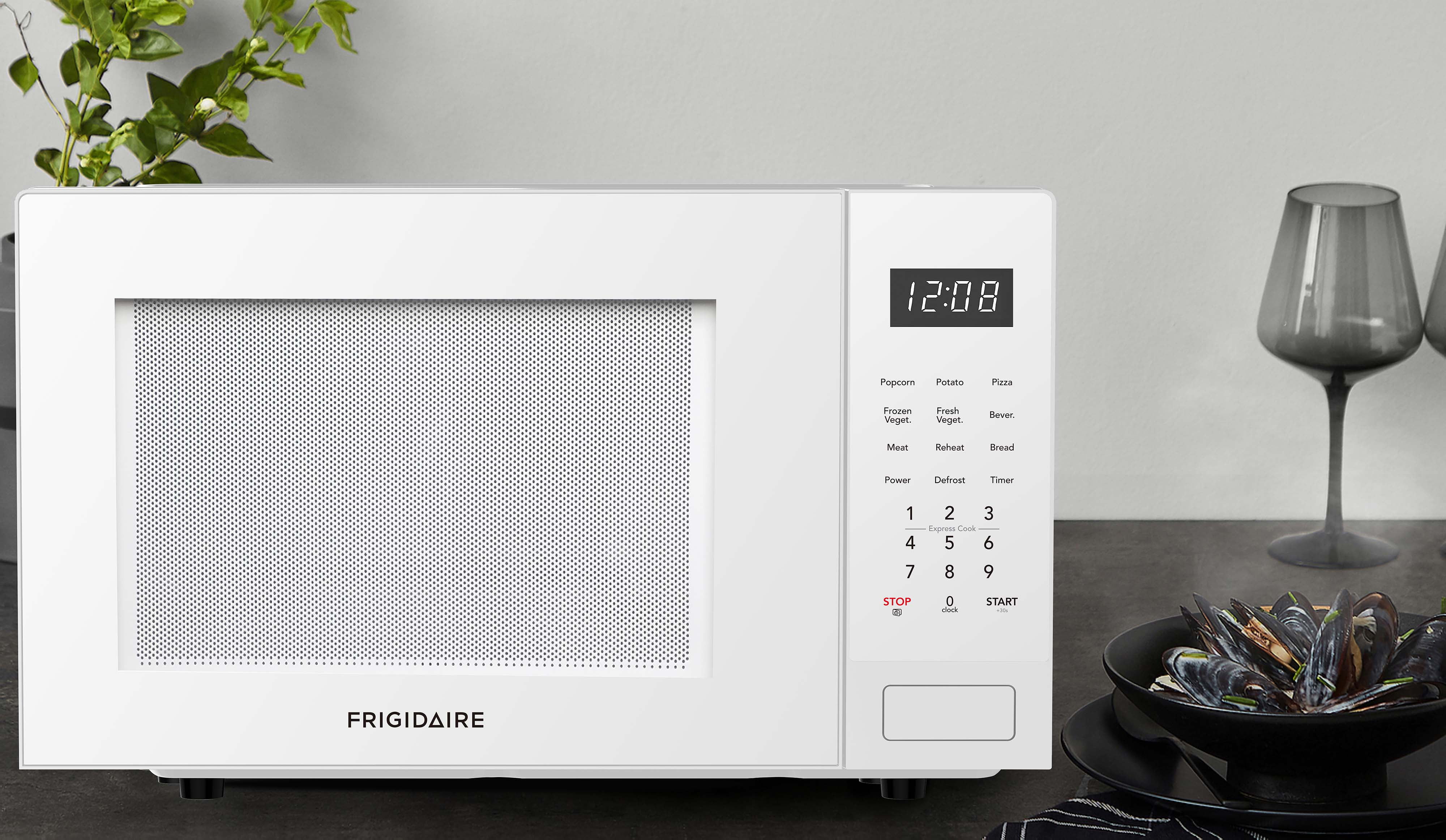 Frigidaire 0.9 Cu. ft. Countertop Microwave Oven, 900 Watt Microwave with 10 Power Levels, White