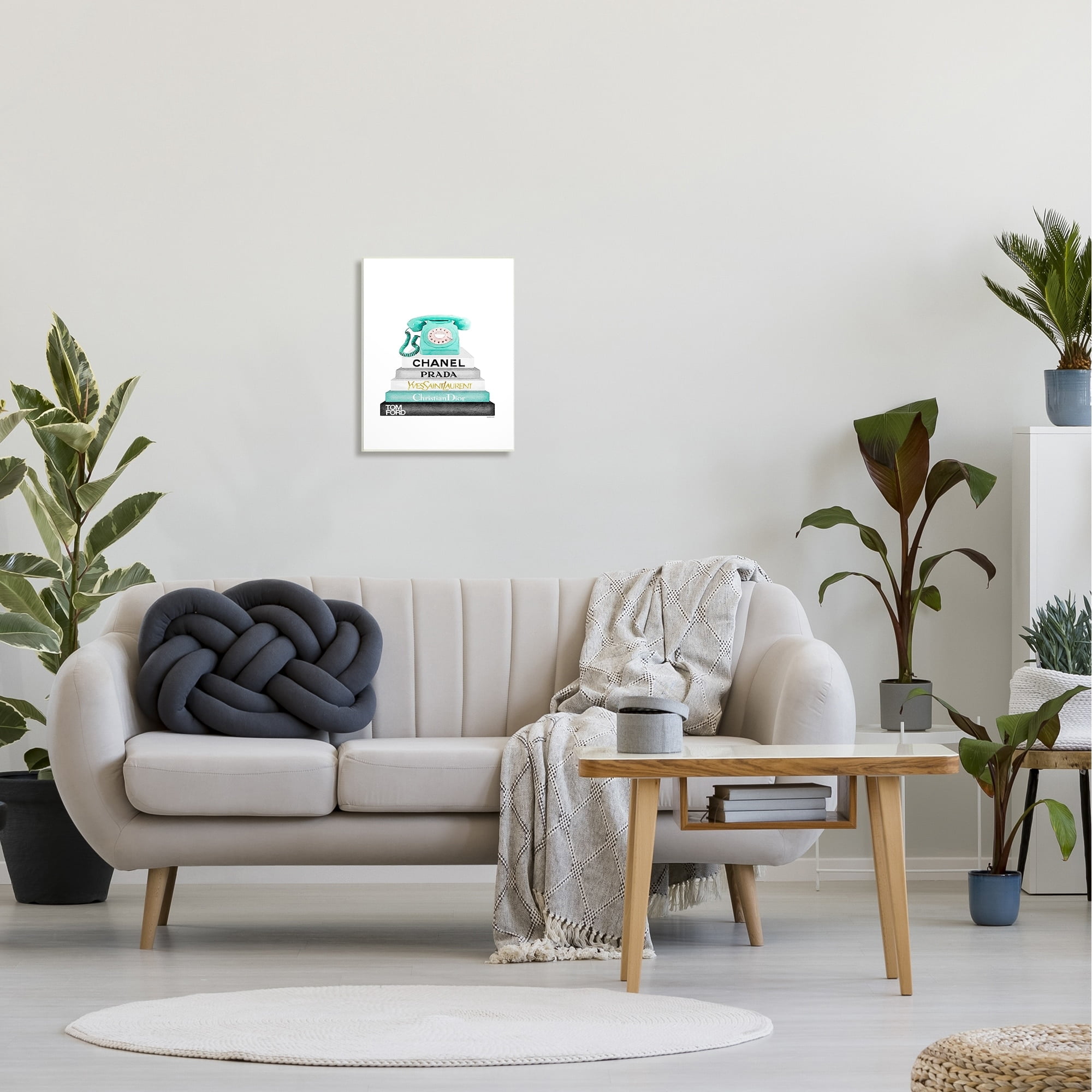 The Stupell Home Decor Grey Teal and Black Fashion Bookstack with Teal Phone Wall Plaque Art
