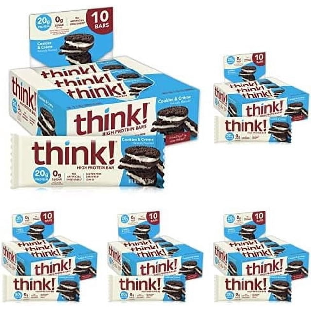 protein bars, high protein snacks, gluten free, kosher friendly, creamy peanut butter, nutrition bars, 2.1 oz per bar, 12 count (packaging may vary) Vista frontal de varias cajas blancas y azules con logo rojo 'think!' y barras envueltas, etiquetas que indican 20 g de proteína y '10 bars' en algunas cajas; cajas agrupadas sobre fondo blanco; aptas como snack post-entrenamiento o para llevar.