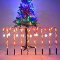 thumbnail image 1 of Muleta solar tricolor de Papá Noel con forma de estrella, copo de nieve, mango de paraguas, caramelo, luz LED para césped para exteriores, 1 of 6